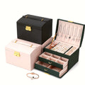 Coffret malle à bijoux, couvercle bombé, poignée et serrure dorée - vue 1