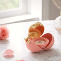 Écrin boule à bijoux, coquille pivotante et nœud doré - vue 3