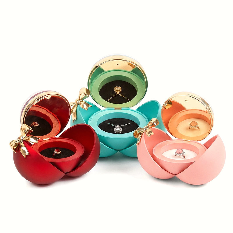 Écrin boule à bijoux, coquille pivotante et nœud doré